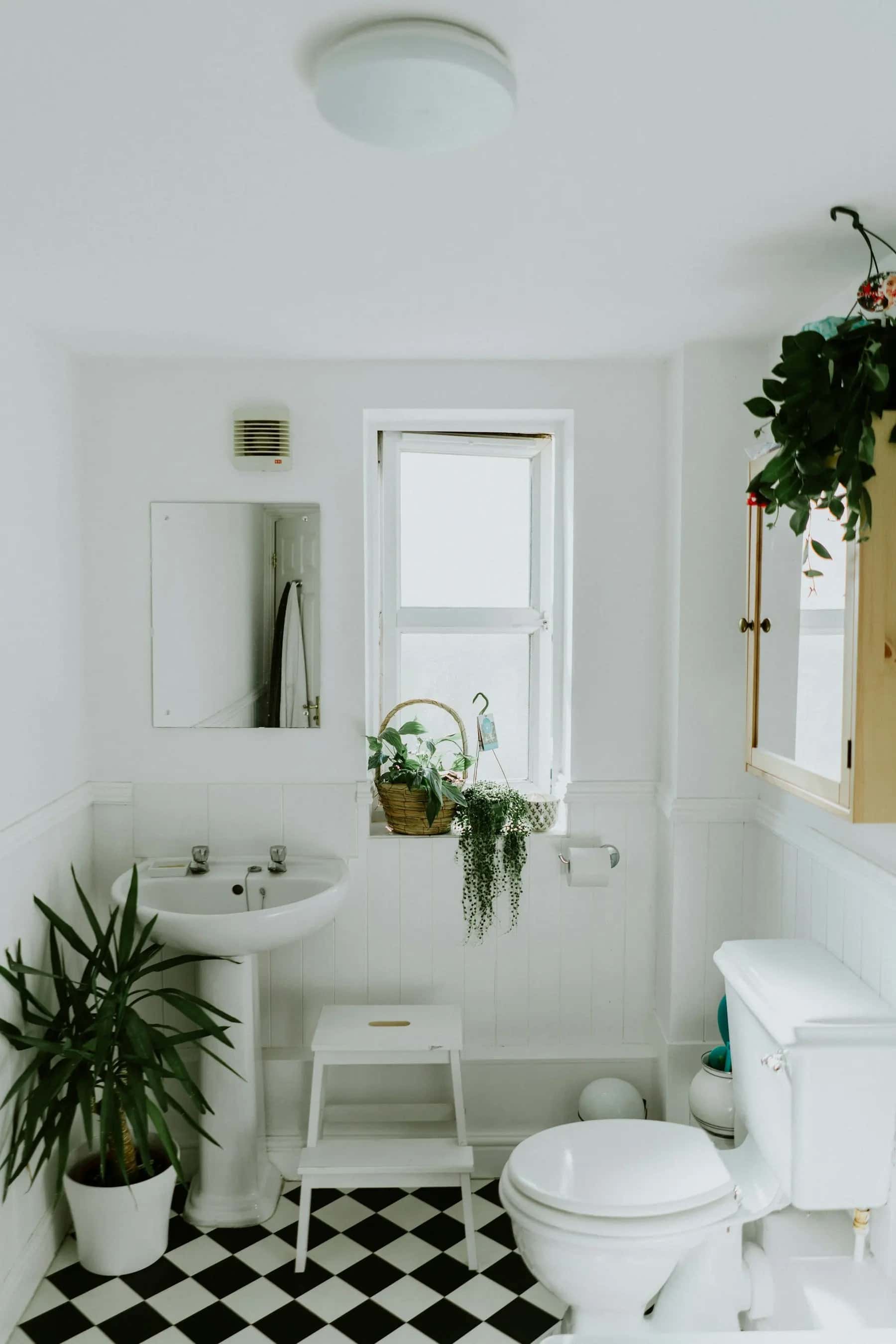 Bright modern bathroom with freestanding tub and natural materials